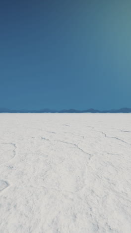 vast white salt flats under a blue sky