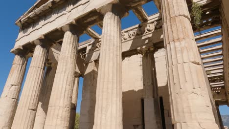 close up looking up at temple of hephaestus with hand held motion