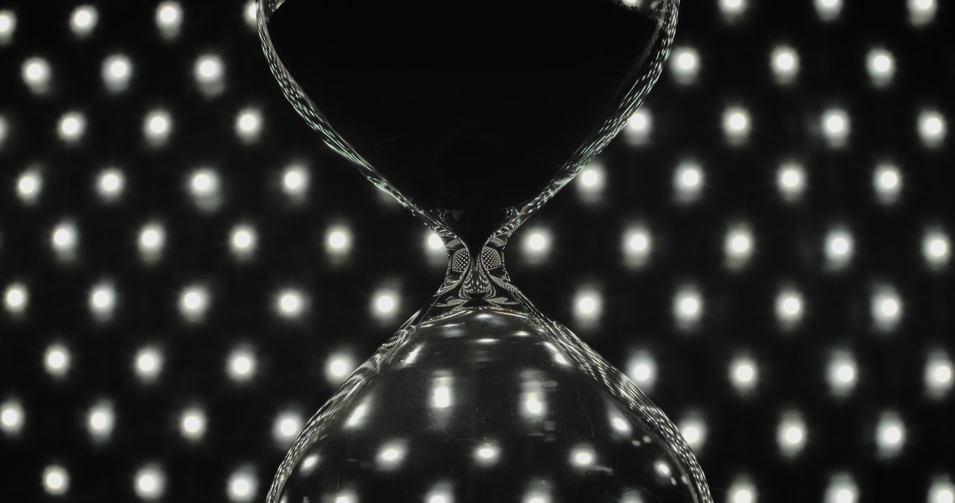 An hourglass with pouring sand