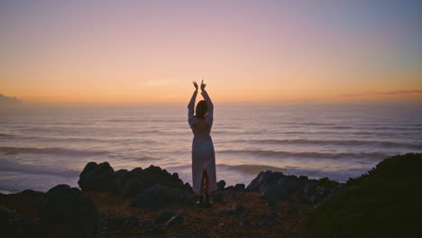 sensual woman silhouette dancing sunset ocean landscape at summer. girl dance