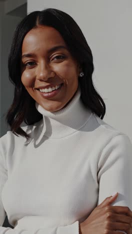 smiling woman in a white turtleneck