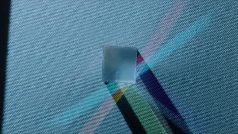 top shot of refracting colored cubes with a blue base