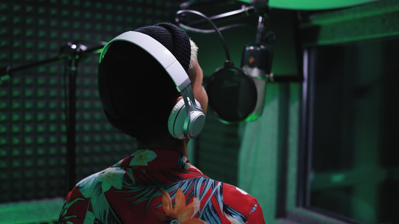 Female singer recording new music album inside boutique studio - Technology and record label industry concept