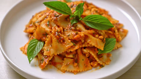 farfalle pasta with basil and garlic in tomato sauce - italian food style