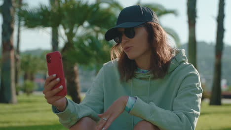 woman on video call in a park