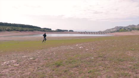 young man jogging on a beach