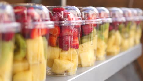 mixed fruit salad in plastic cups