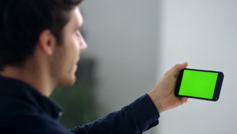 close-up view of business man making video call on smartphone