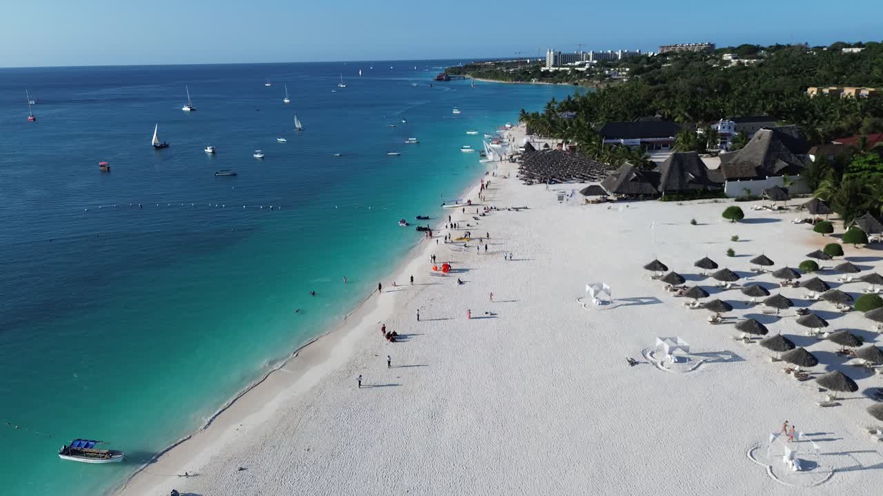 Aerial View of Tropical Beach Resort with Turquoise Water and Sailboats