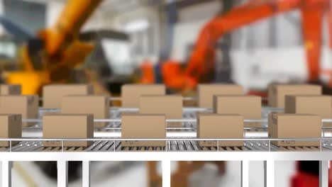 Multiple delivery boxes on conveyor belt against factory in background