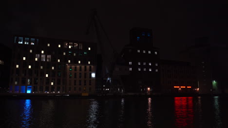 modern buildings on the harbor with changing lights