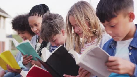 group of kids reading books