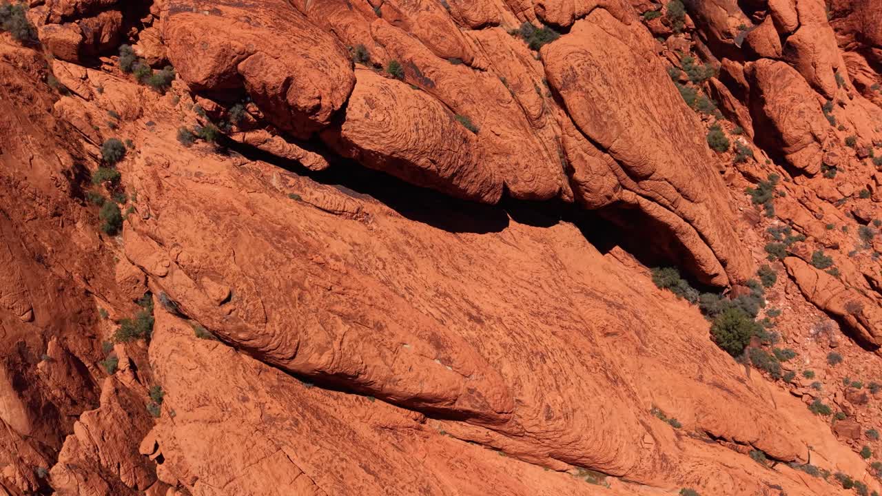 Moving beyond the grand vistas, this shot explores the intimate and beautiful details of the Red Rock Canyon landmark from a unique top-down perspective