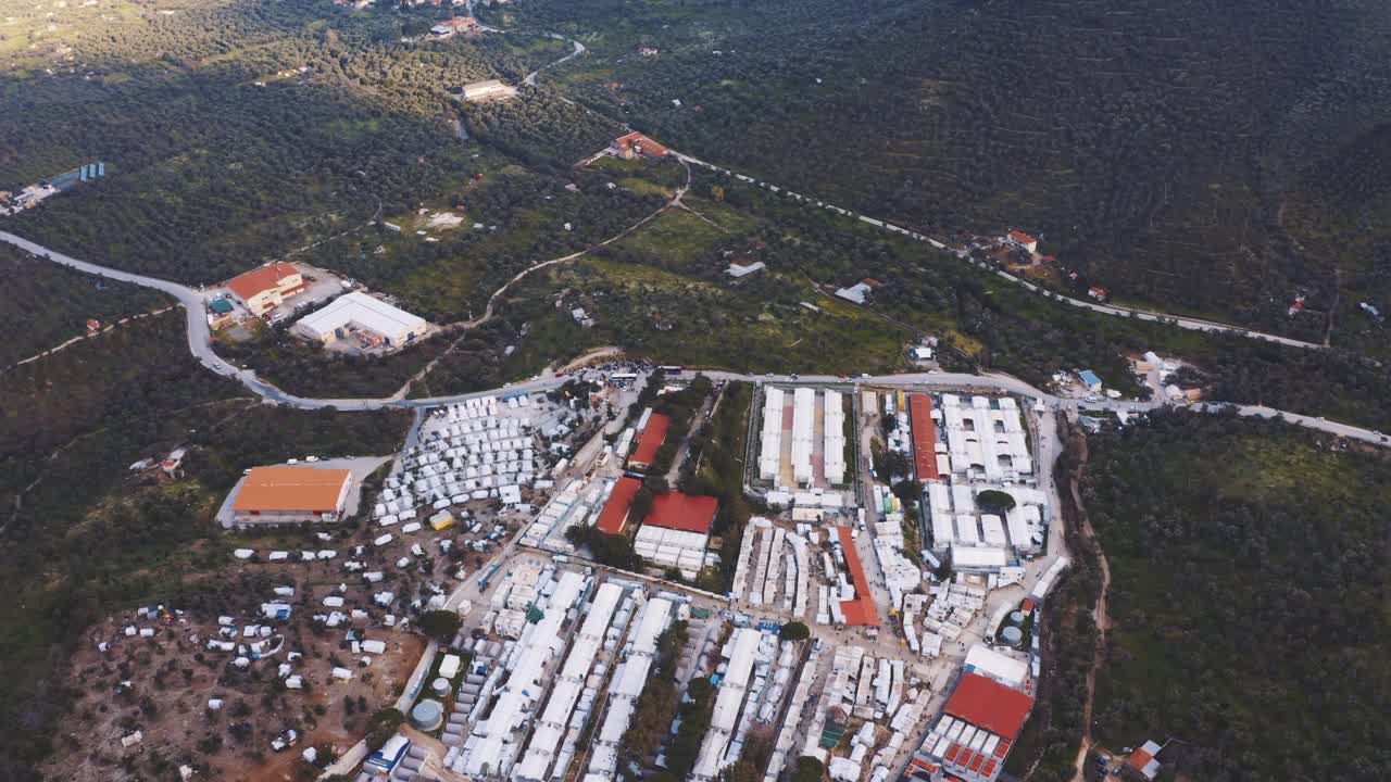 Aerial View Of Moria Refugee Camp In Greece. Follow Shot, High Angle