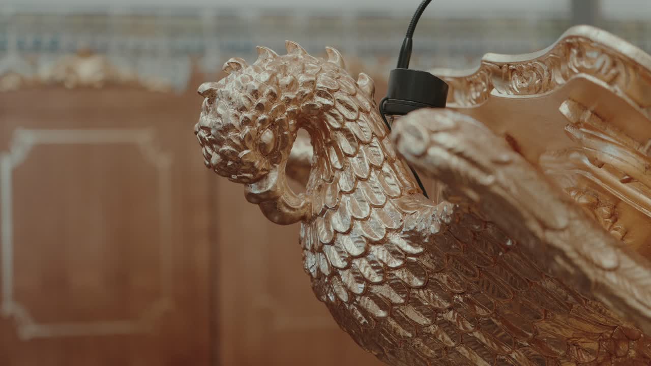 Majestic golden dragon sculpture exudes regal elegance