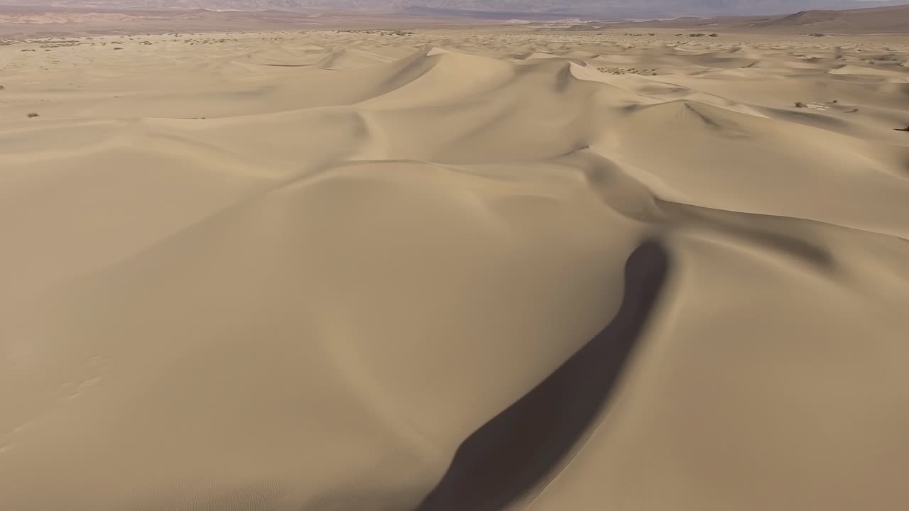 Sanddunes as far as you can see in the desert of california