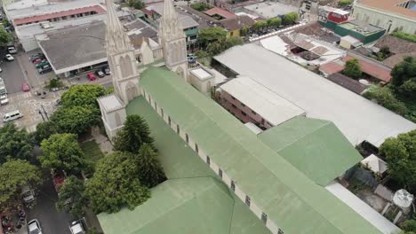 old cathedral of nuestra senora del carmen in el salvador and surrounding town- aerial shot