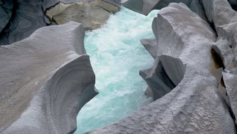 fresh cold glacier water between beautifully shaped stones, marble castle, norway