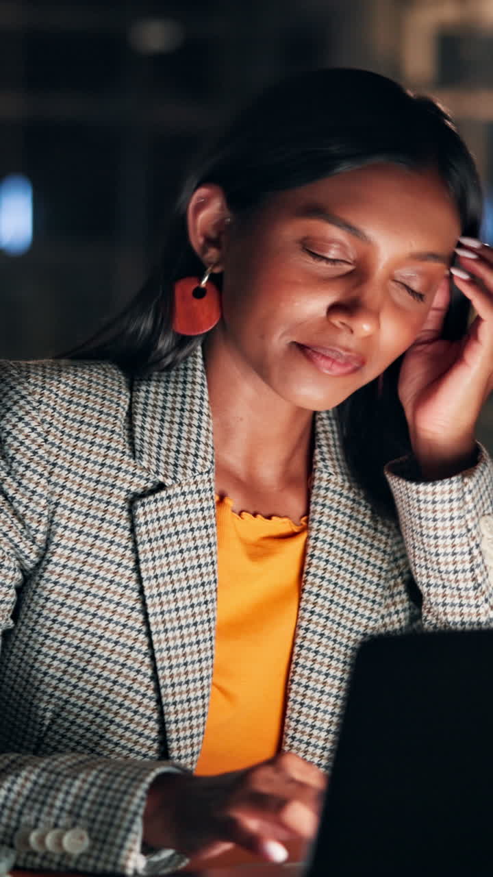 Sleepy Woman Yawning While Working Overtime on Laptop
