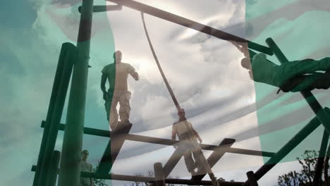 waving nigeria flag against male soldiers rope climbing during obstacle course at boot camp