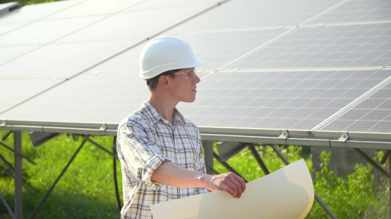 Solar panel technician working with solar panels. The green energy concept
