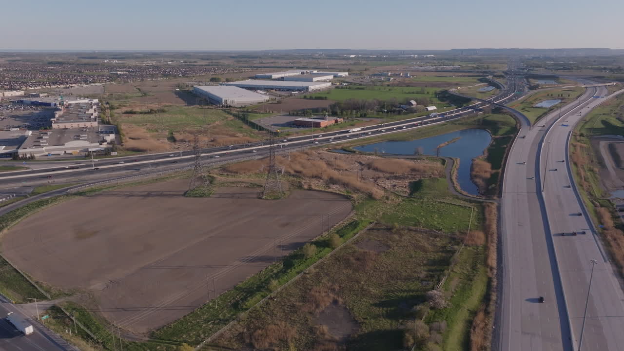 Mississauga's highway 401 with industrial areas and greenery, aerial view