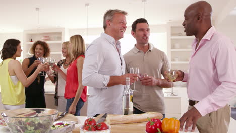 group of mature friends enjoying dinner party shot on r3d