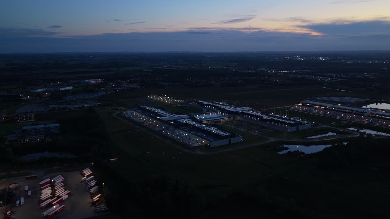 Sunset over Meta’s glowing data campus, aerial night scene