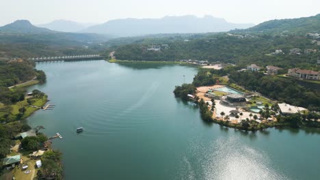 Drone-view-of-city-lake-in-Aamby-Valley-in-Pune,-India