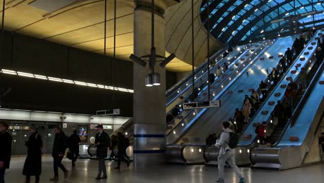 coming down the canary wharf underground station, london, united kingdom