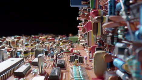 complex circuit board with colorful electrical components, probe lens detail