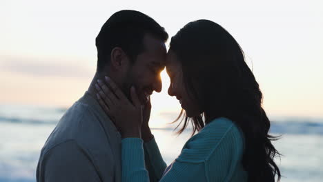 Hug,-sunset-and-silhouette-of-couple-at-beach