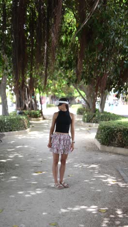 woman wearing vr headset in a park