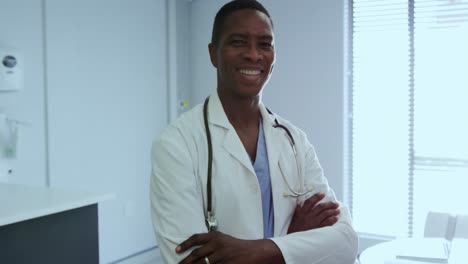 male doctor standing with arm crossed in the hospital