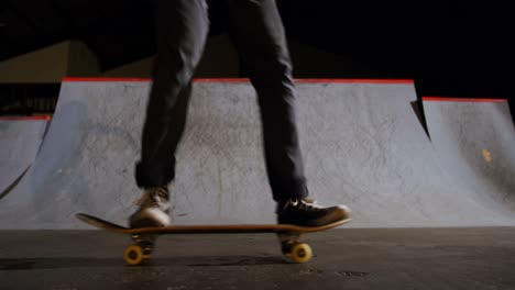 man practicing skateboarding in skateboard arena 4k