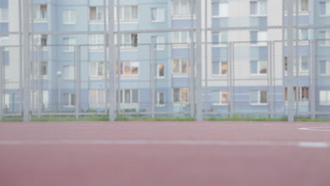 man playing basketball on outdoor court