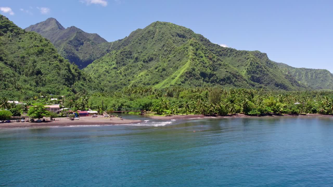 Aerial Reveal Shot of Tahitian Beach with Mountains and Jungles at Teahupo'o on Tahiti Iti