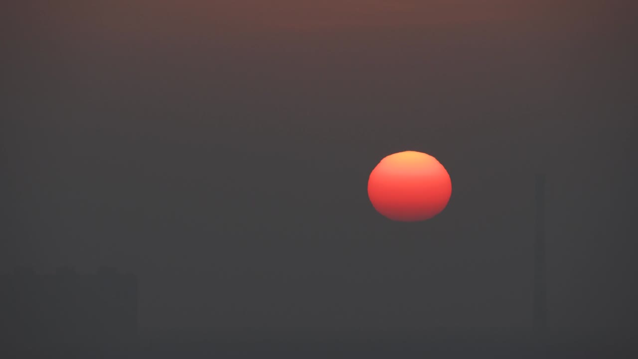 The picturesque sunrise in the dark sky