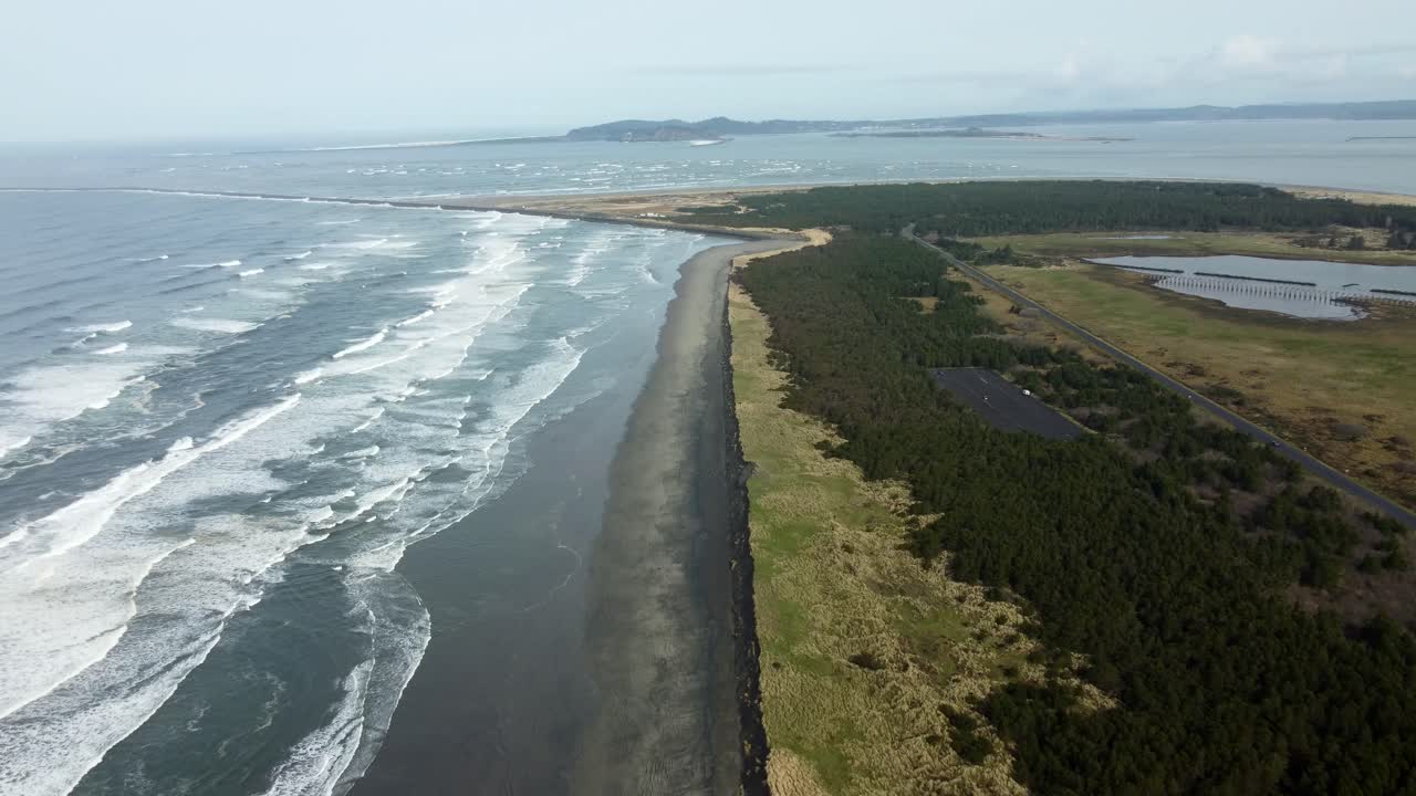 US, Oregon, Astoria, Fort Stevens, 2025-03-21 - Drone view of the northwest tip of Oregon where the Columbia River meets the Pacific Ocean. Fort Stevens State Park, jetty, and Washington.