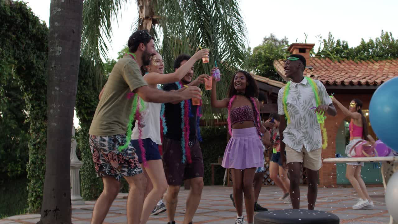 Friends Enjoying a Lively Outdoor Party with Confetti