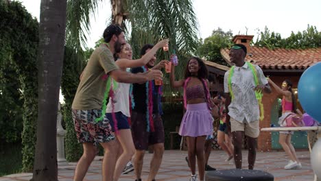 friends enjoying a lively outdoor party with confetti