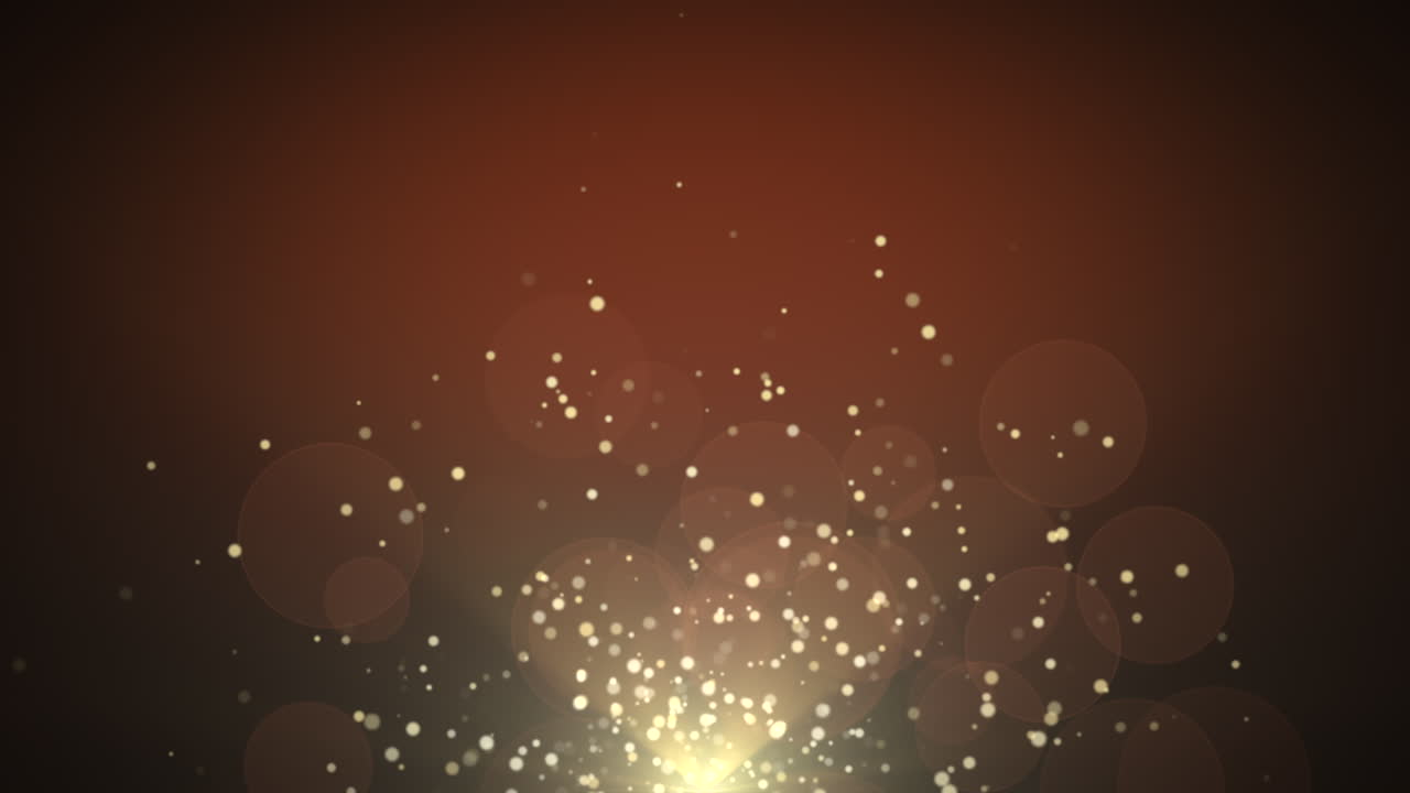 movimiento y mosca partículas de oro y bokeh redondo sobre fondo oscuro