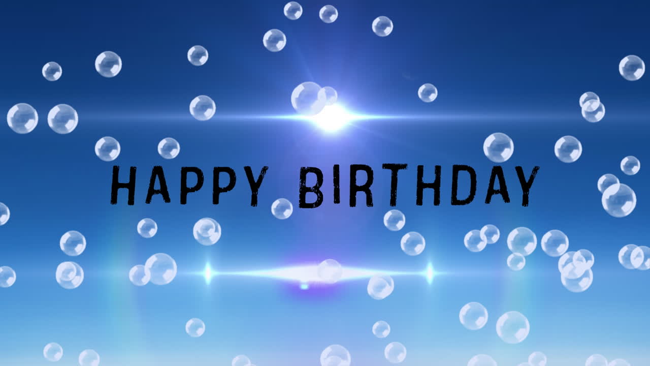 파란색 배경의 '생일 축하' 문구 위 거품 애니메이션