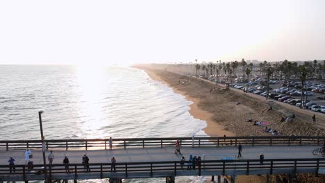 excellent aerial view pulling away from the pier and beach at newport beach, california