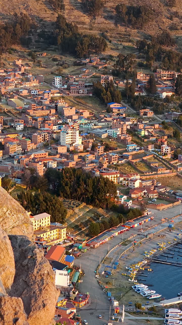 Experience an incredible aerial view of Copacabana, Bolivia, during a stunning sunset. This video captures the vibrant evening colors over Lake Titicaca