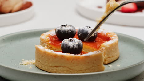 delicious bite of a tart with blueberries