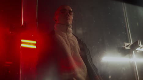 stylish man in urban lighting