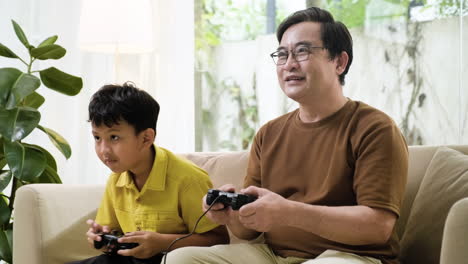 asian man and boy in the living room