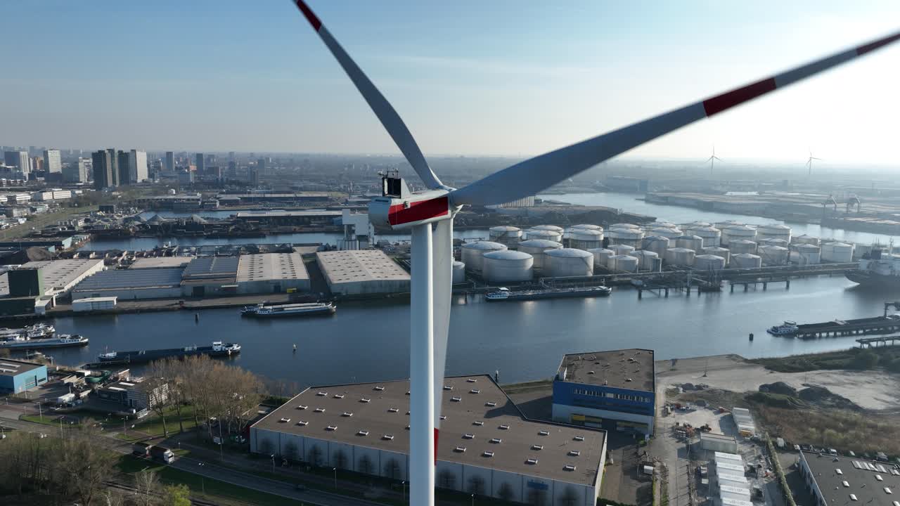port of Amsterdam, wind turbines, renewable energy, aerial drone view.
