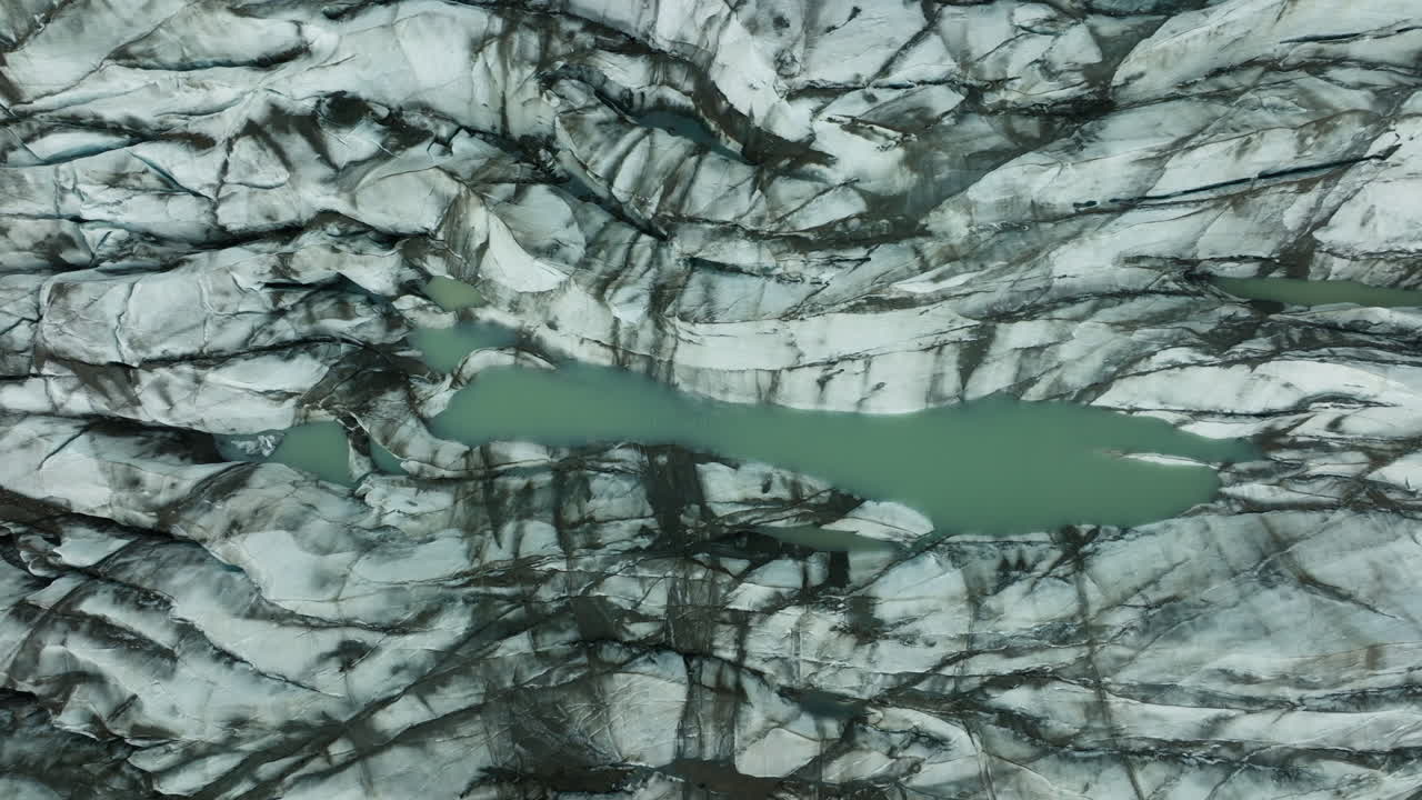 Aerial View of a Glacier with Meltwater Lakes